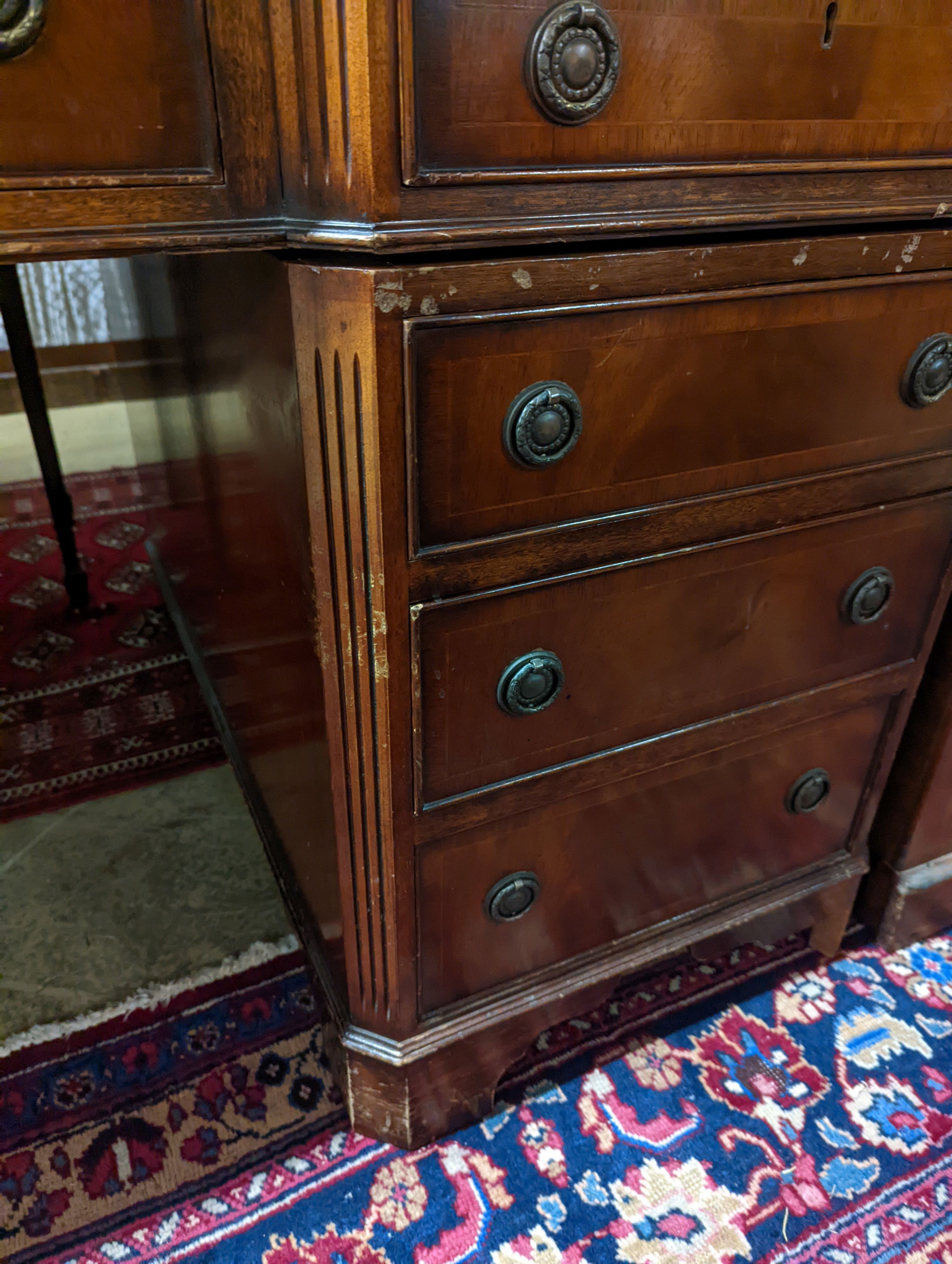 A reproduction George III style mahogany pedestal desk, length 150cm, depth 90cm, height 76cm